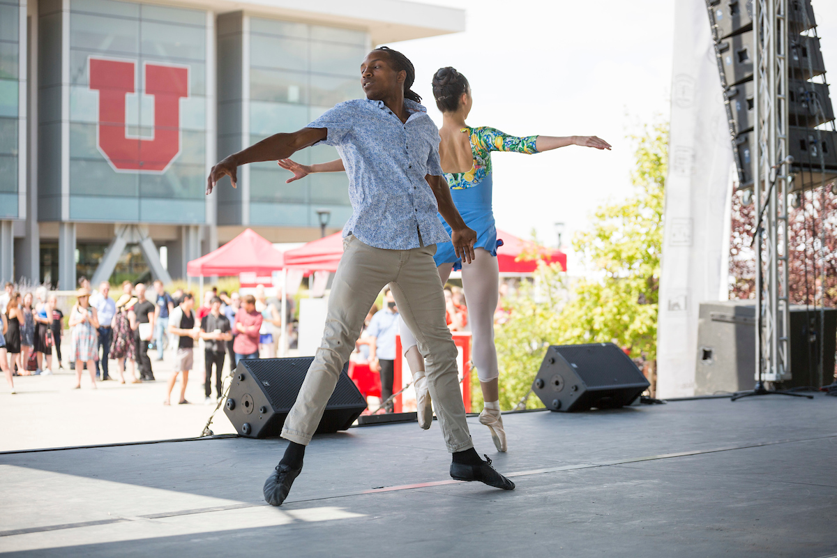 students performing dance on an outdoor stage